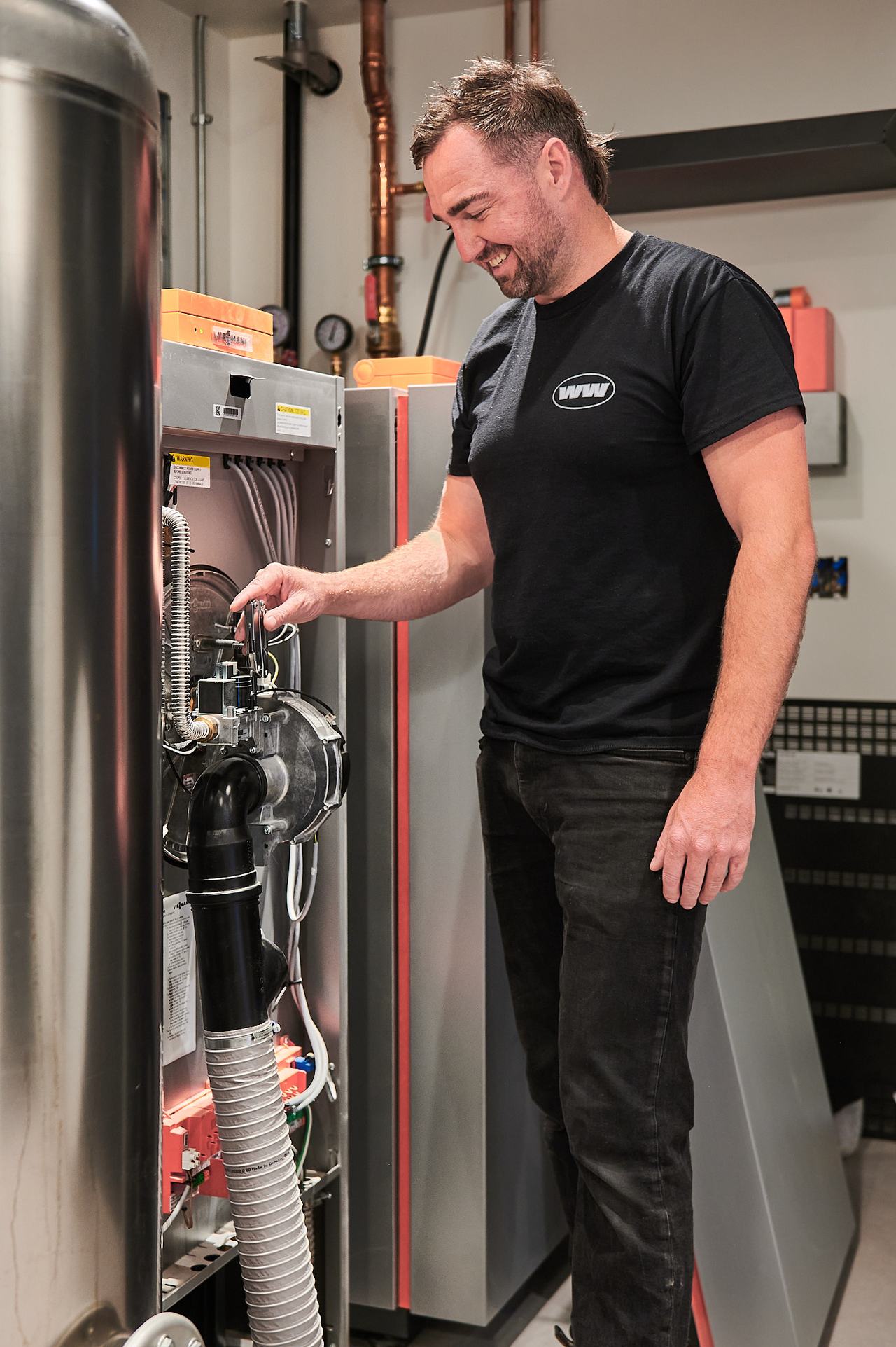 Waywest technician servicing a residential boiler in Qualicum Beach