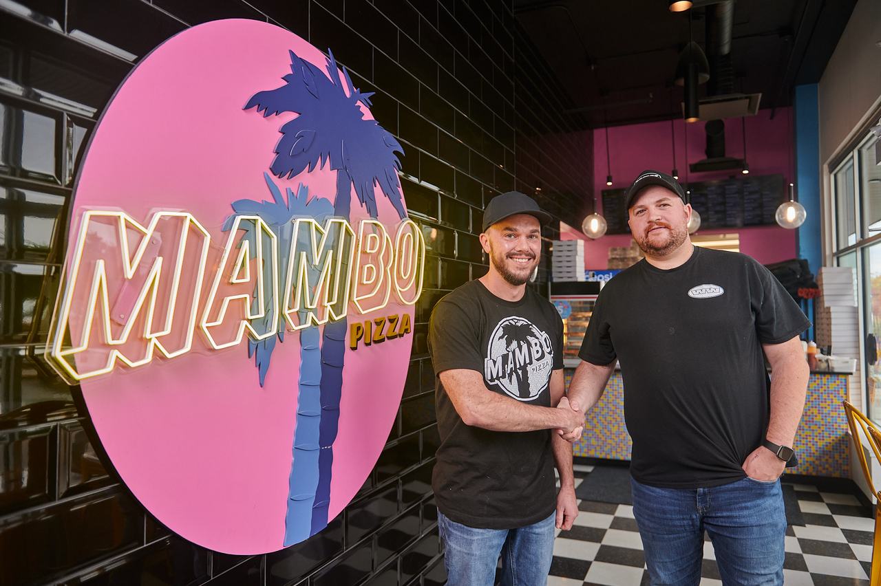 Waywest technician shaking hands with a client at Mambo Pizza