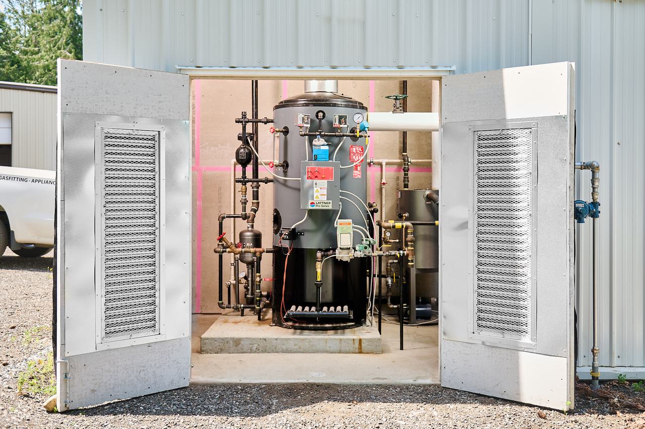 Gas-fired water heating equipment in an outdoor enclosure at a Nanaimo oyster farm