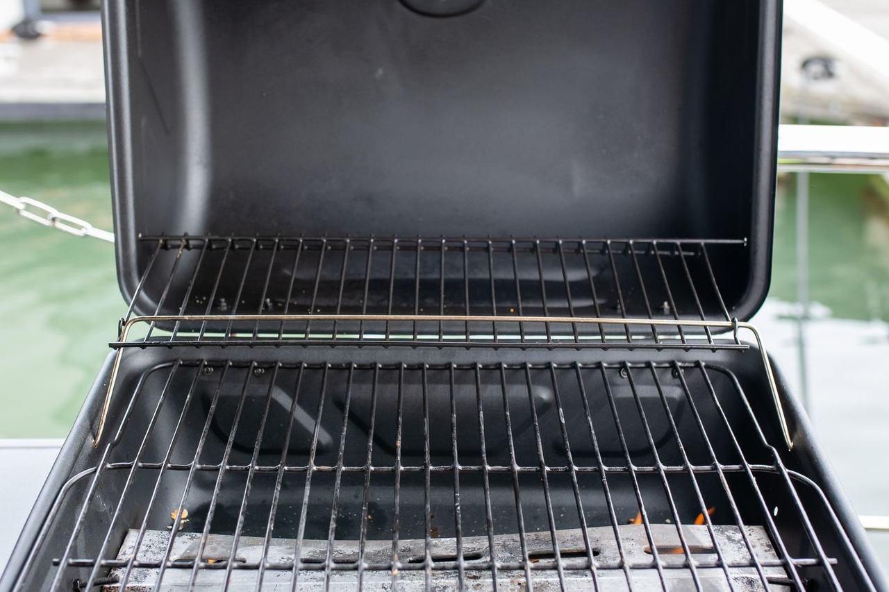 Open outdoor barbecue grill on a patio