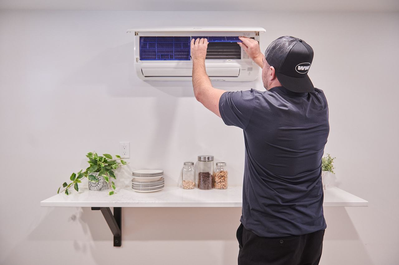 Waywest technician servicing a ductless mini-split heat pump in Nanaimo