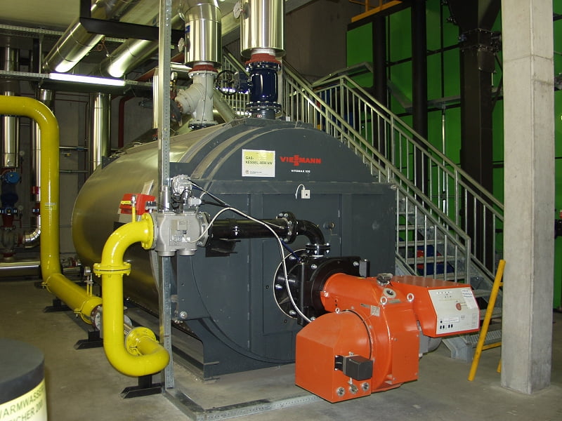 Grey commercial boiler with piping